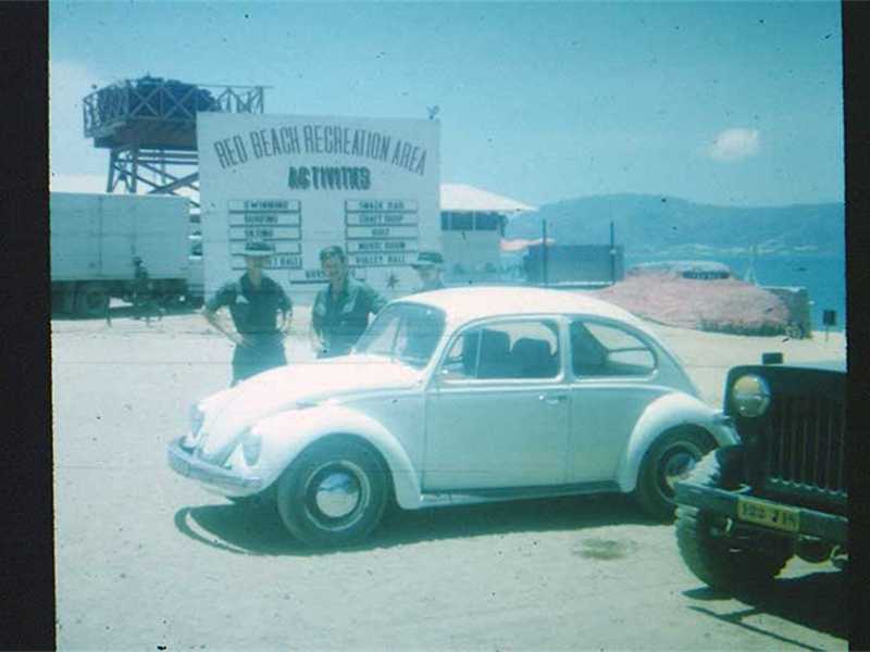 Red Beach “used car lot”…NOT! VW was probably staff car for USO personnel. Red Beach “used car lot”…NOT! VW was probably staff car for USO personnel.